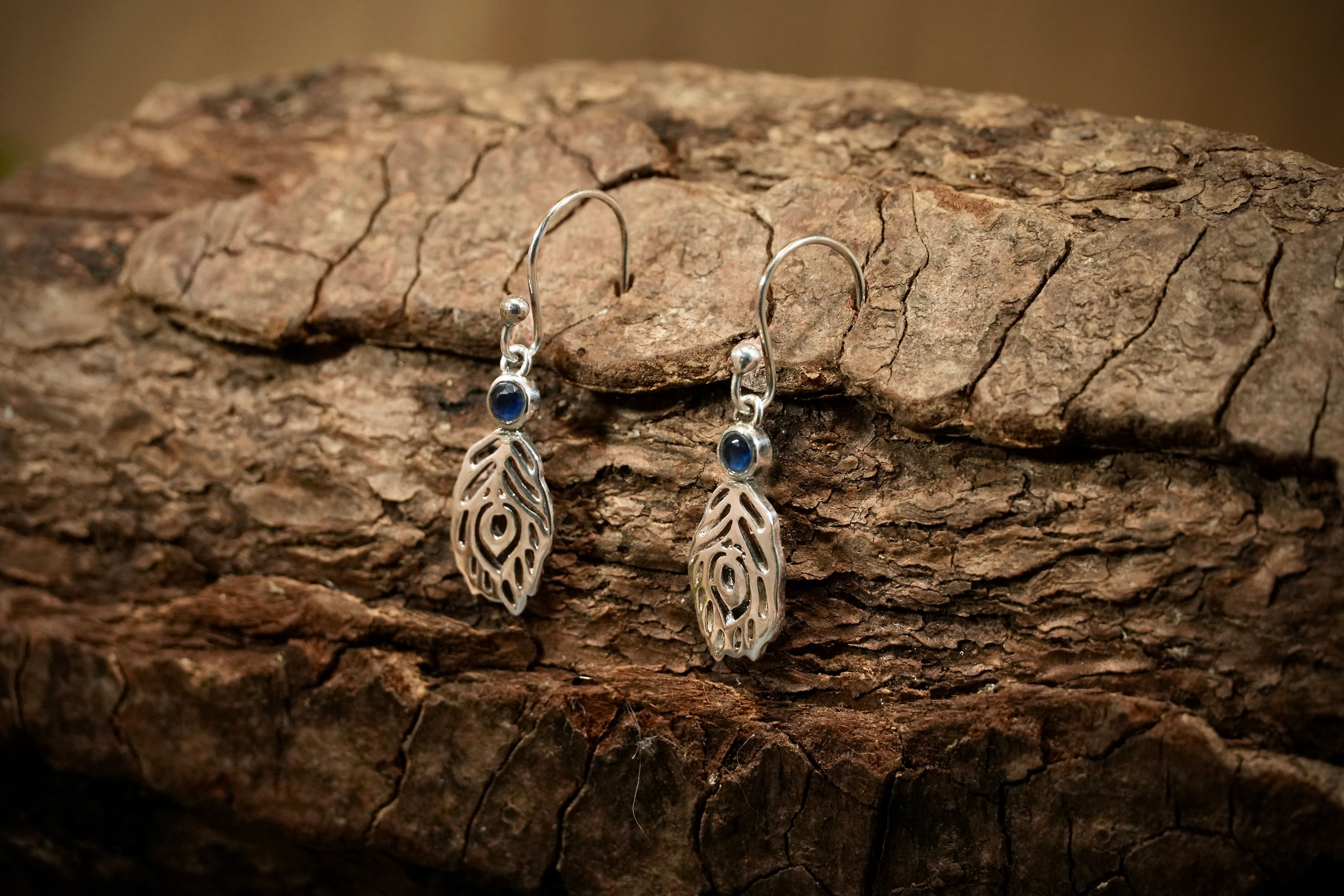 Feather drop earrings with topaz