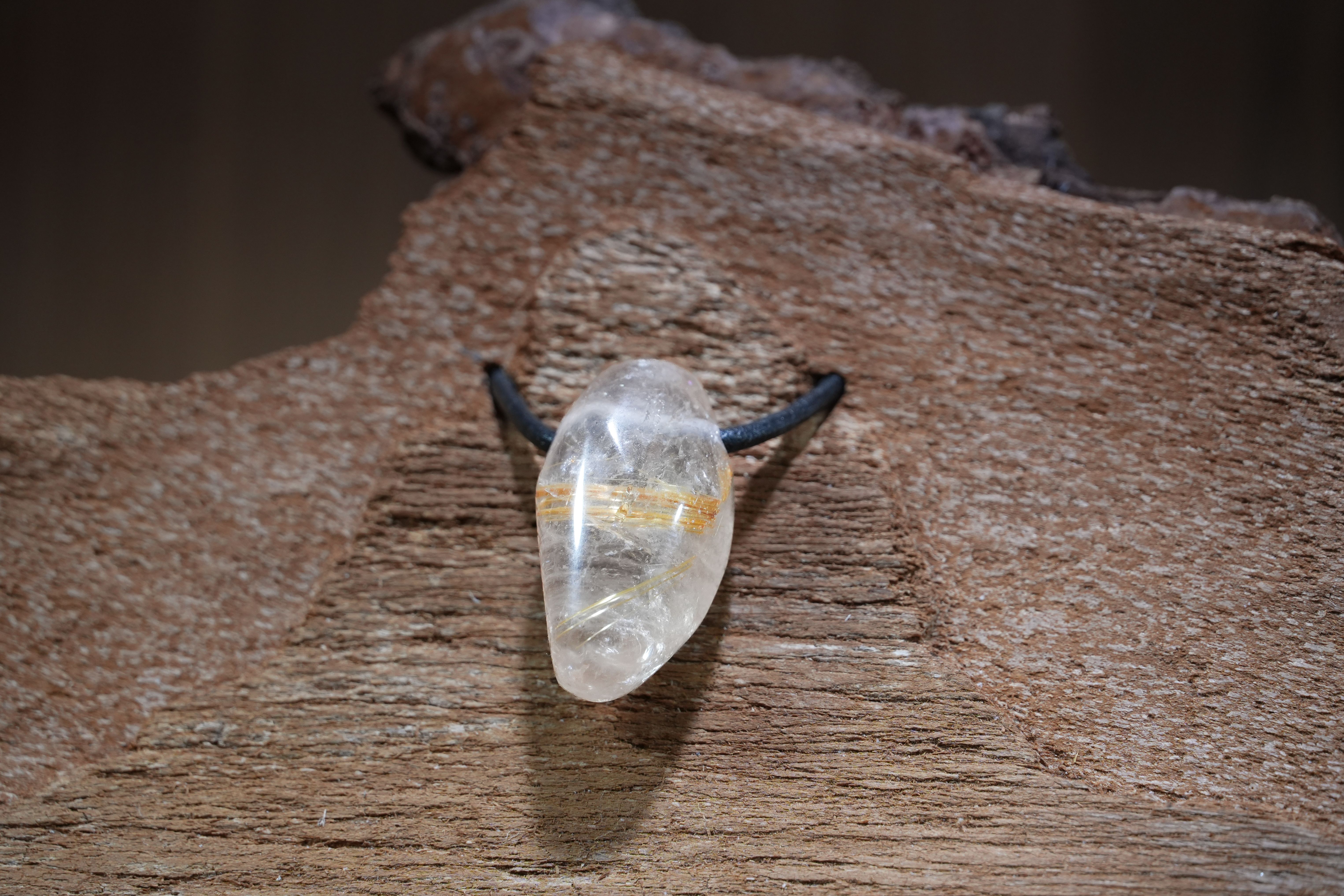 Rutilated quartz, Drilled · No. 1, 1.5 × 3.2 cm