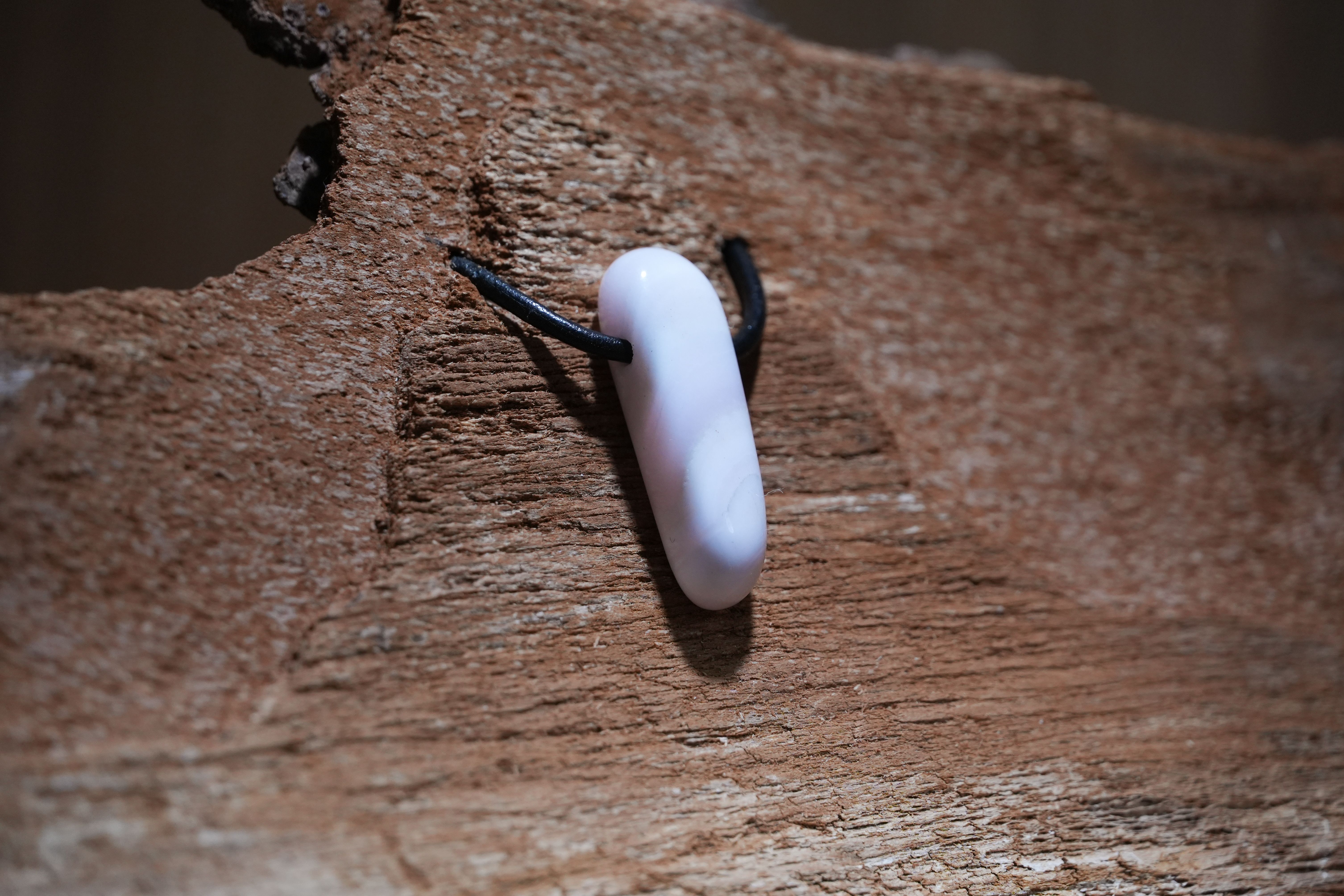 Pink calcite, Drilled · No. 1, 1 × 3.5 cm