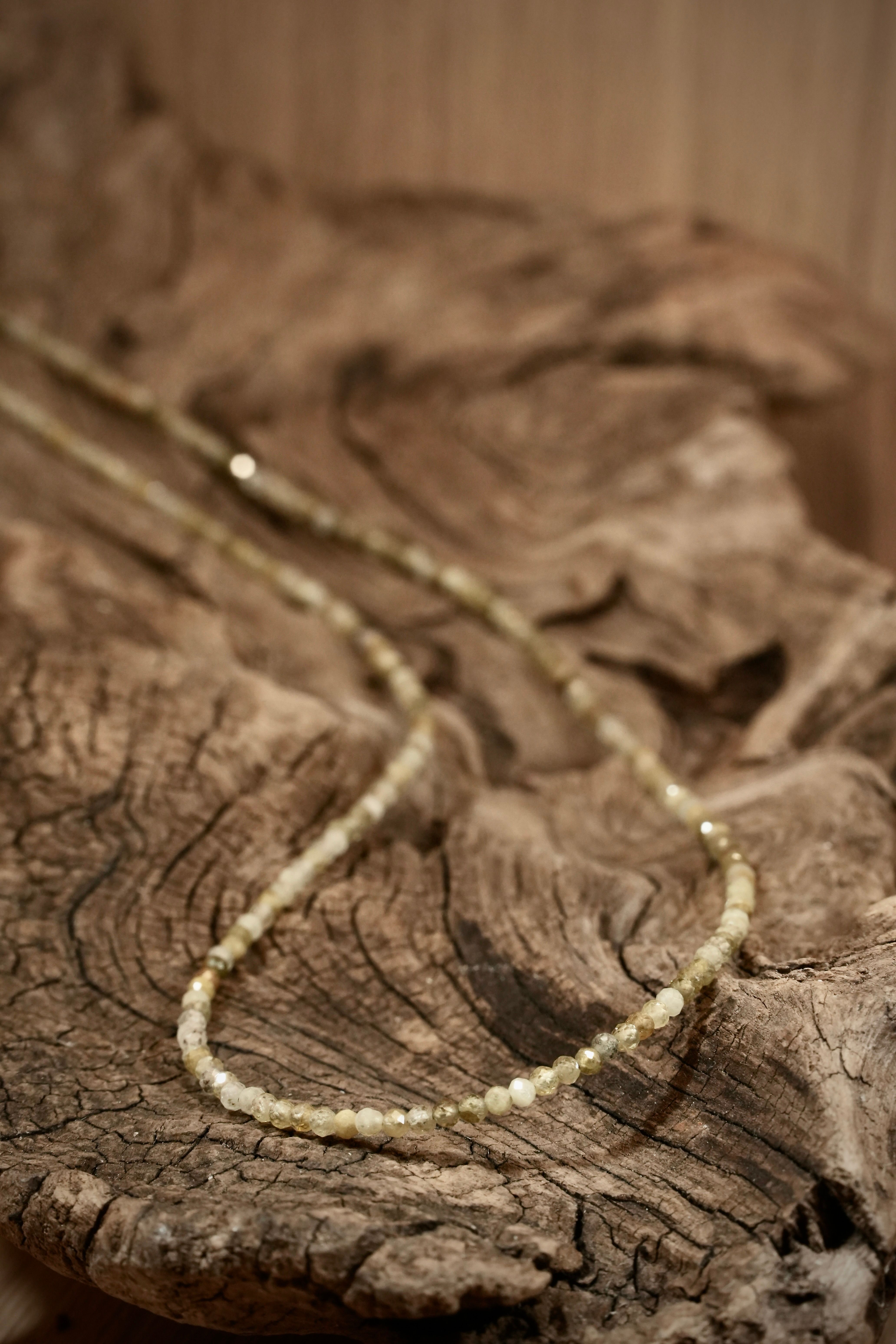 Grossular Pearls necklace on root wood