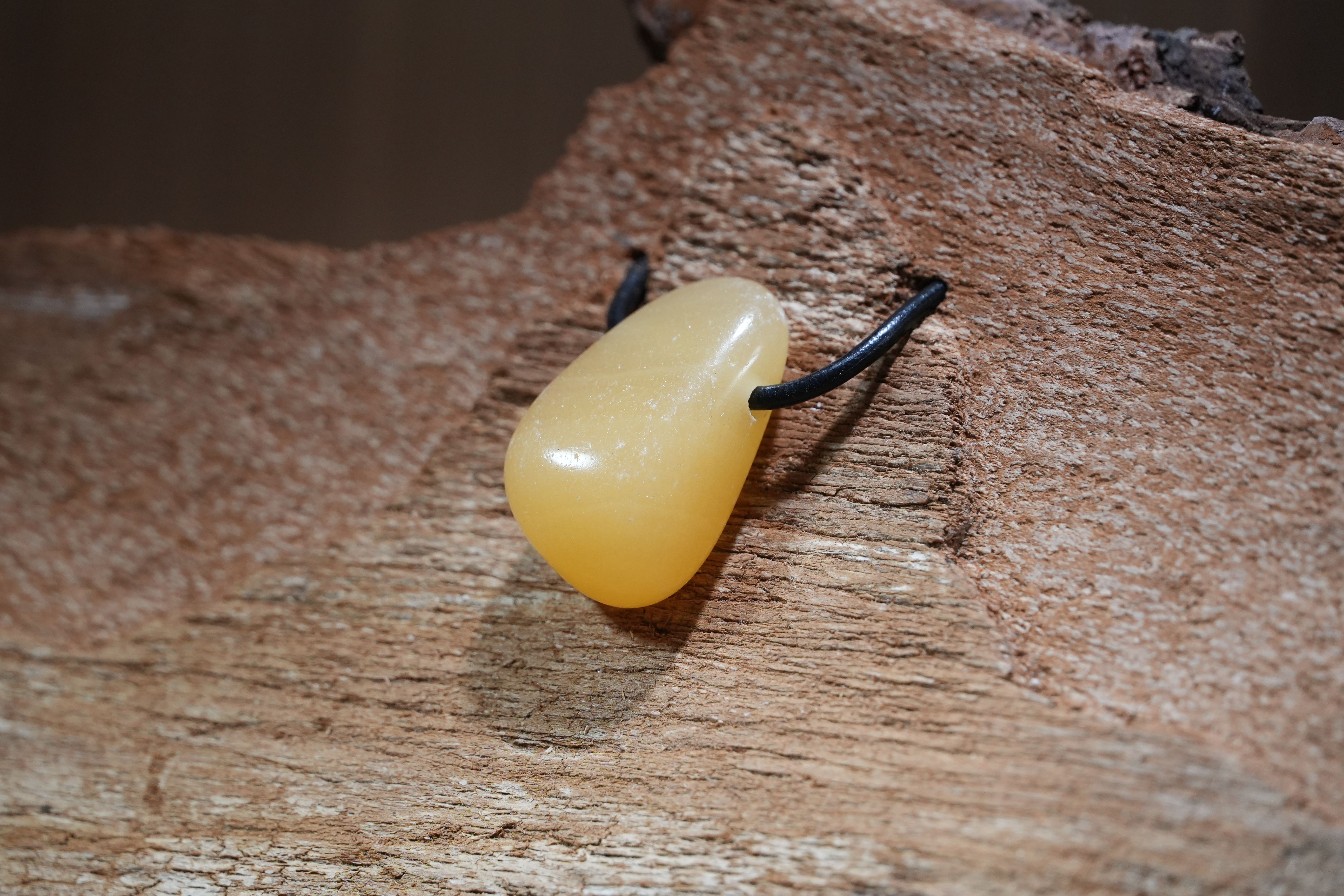 Orange calcite, Drilled · No. 1, 2 × 3.3 cm