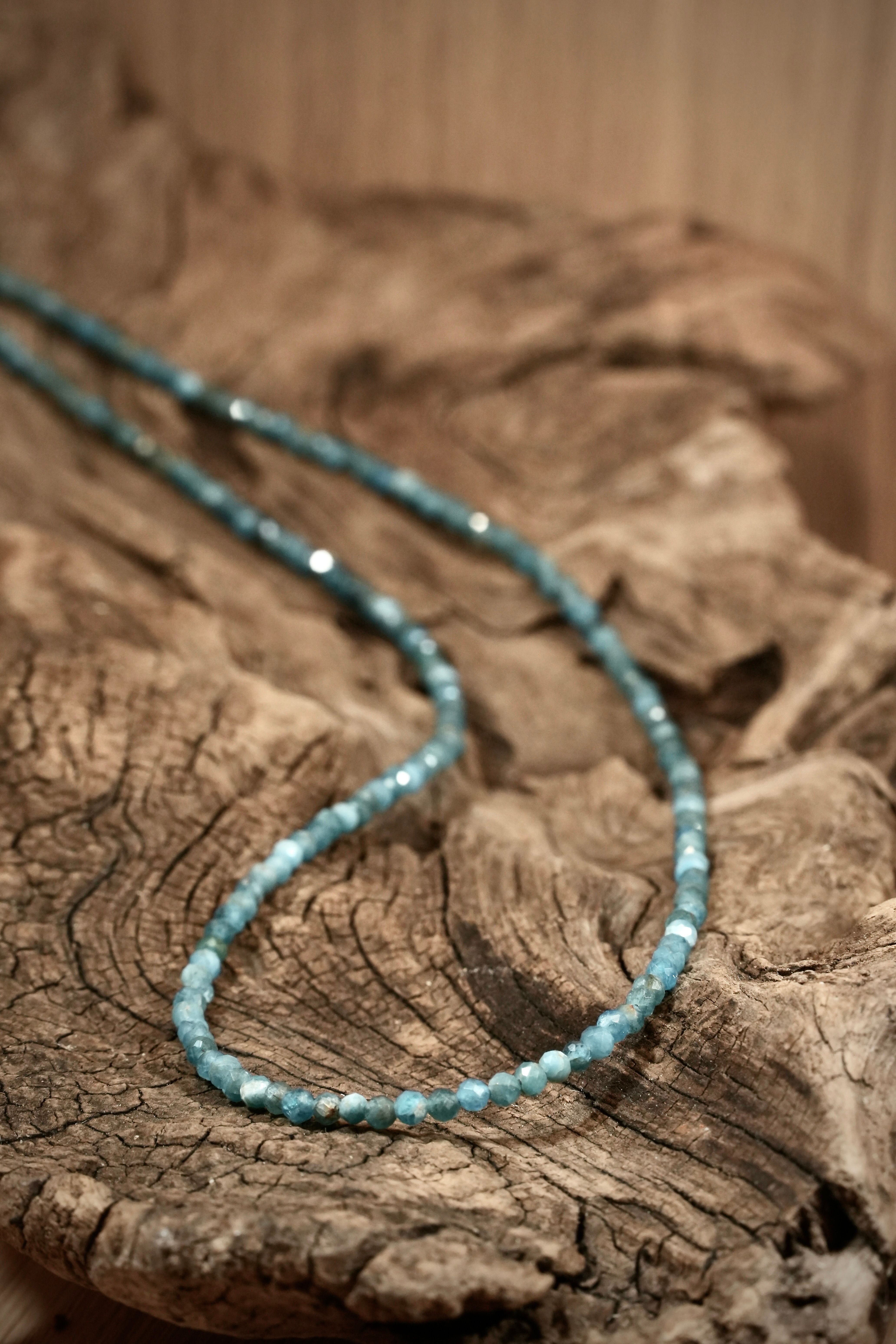 Apatite Pearls necklace on root wood