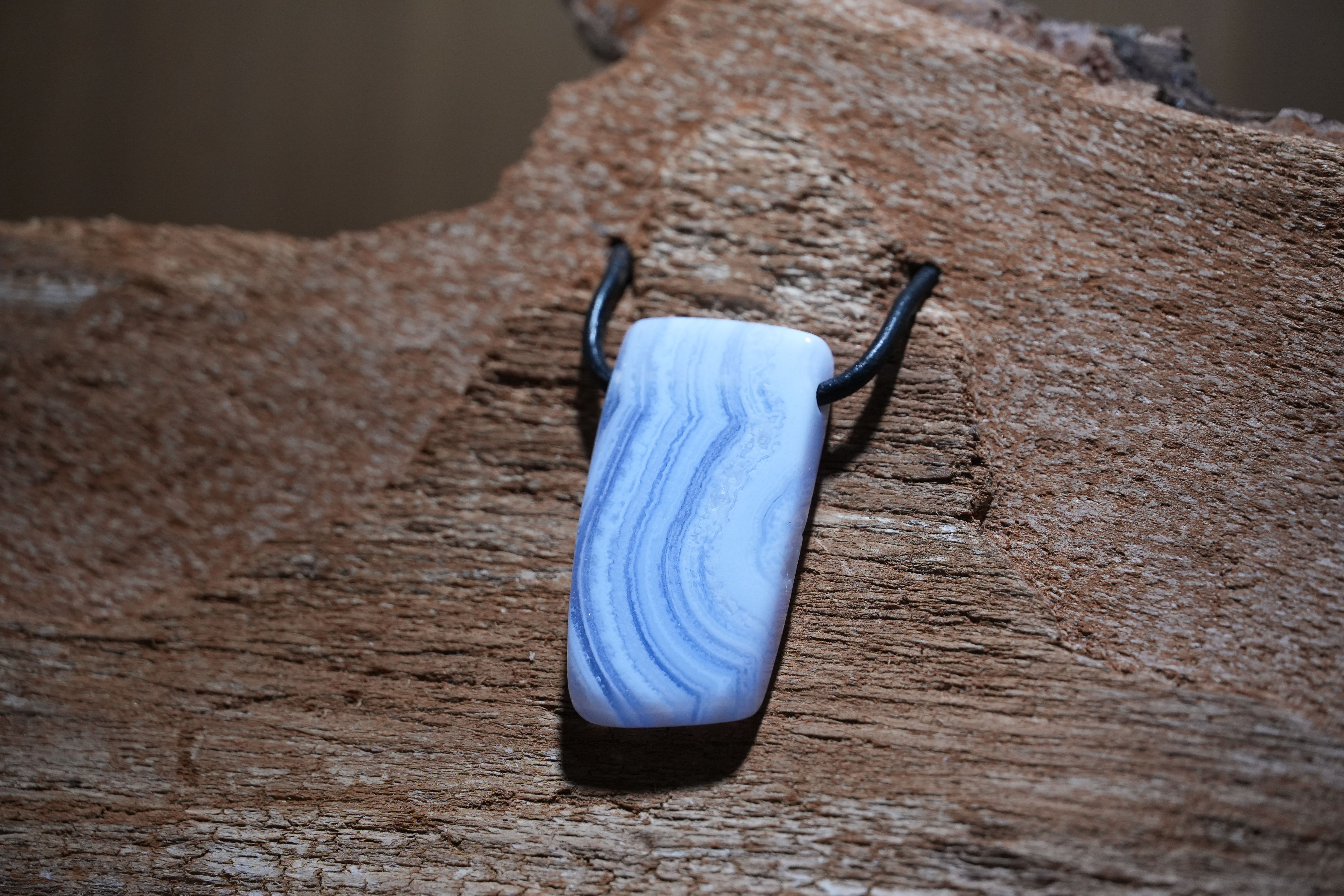 Banded chalcedony, Drilled · No. 1, 2 × 3.9 cm
