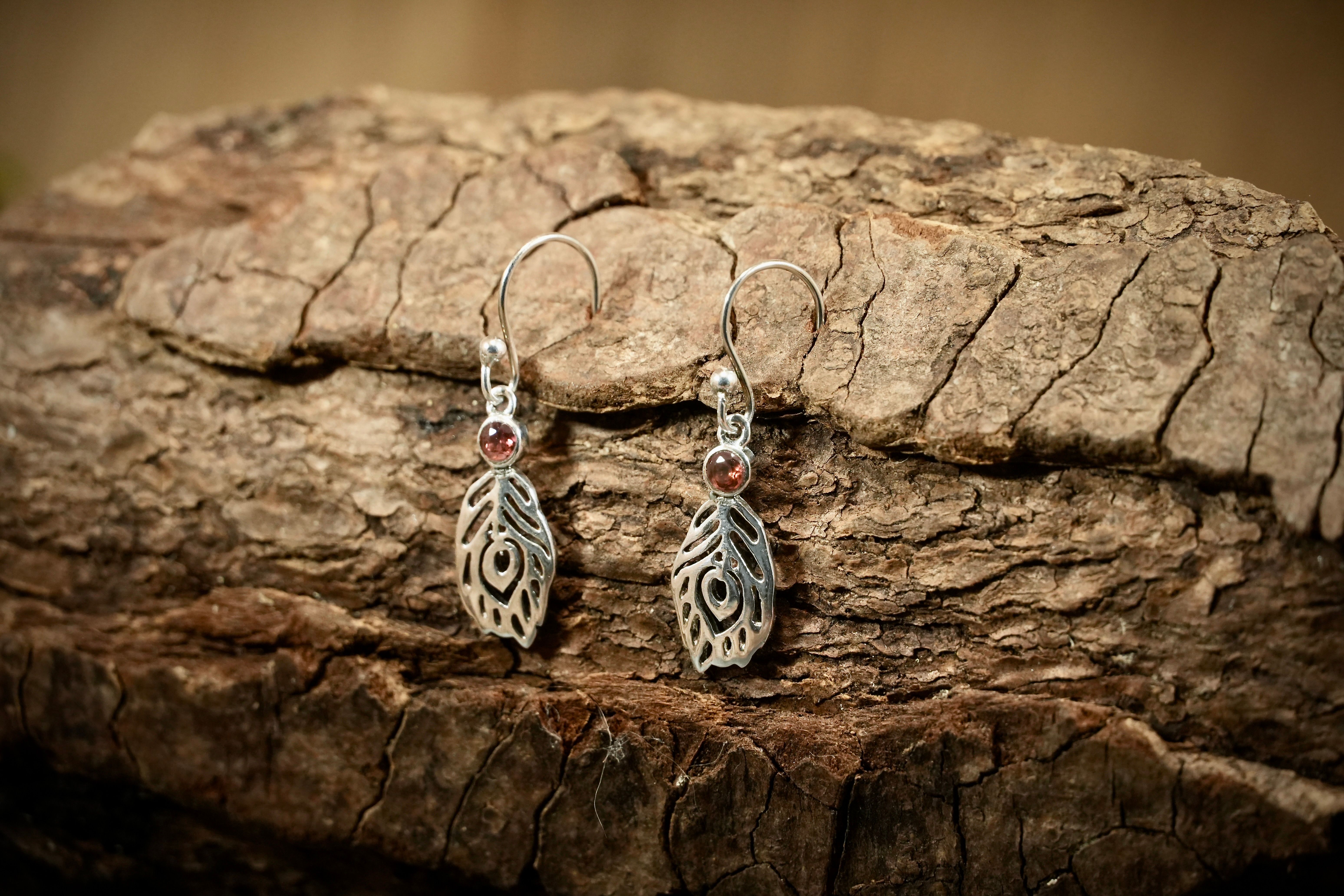 Feather drop earrings with hessonite
